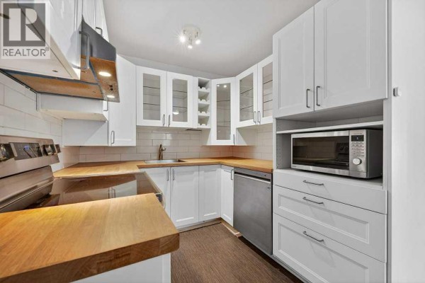 Primary Bedroom - 202a, 5601 Dalton Drive Nw, Calgary, AB T3A2C3 Photo 3