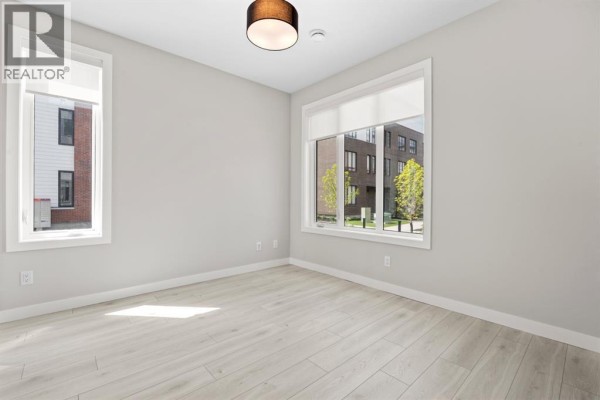 Dining room - 203, 8155 8 Avenue Sw, Calgary, AB T3H6B1 Photo 3