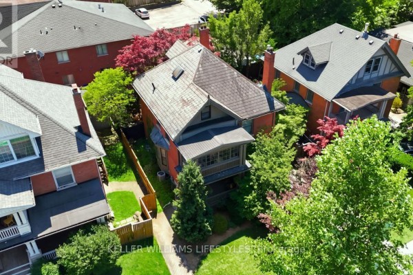 Aerial view of the residential property showing the house, yard, and surrounding rooftops. - 203 Cheapside Street, London East