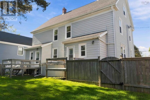 Front view of a light blue duplex with visible twin entrances and white railings. - 203/205 Gray Street, Windsor