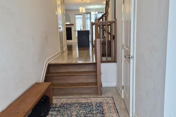 Entryway with tile flooring, wooden bench, and staircase - 2037 Allegrini Terrace, Ottawa