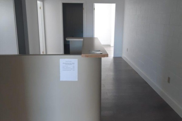 Kitchenette with white cabinets, sink, and subway tile backsplash - 203a&b - 112 Queenston Street, St  Catharines