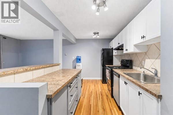 Living room - 204, 112 23 Avenue Sw, Calgary, AB T2S0J1 Photo 2