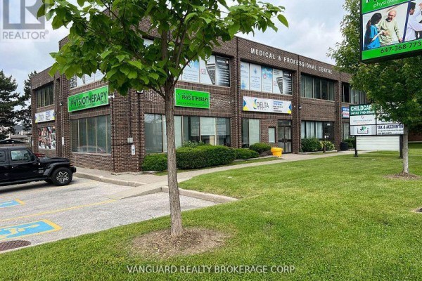 Exterior view of the medical and professional centre with green landscaping. - 204 - 2978 Islington Avenue, Toronto