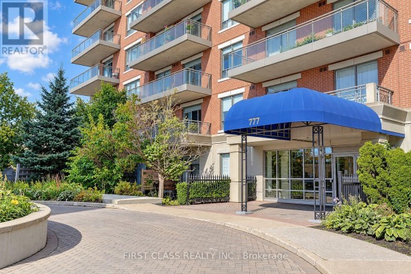Close-up view of the blue awning over the entrance of apartment building 777. - 204 - 777 Steeles Avenue W, Toronto