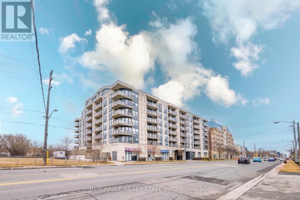 Street view of the apartment building with traffic on Sheppard Avenue West. - 204 - 872 Sheppard Avenue W, Toronto