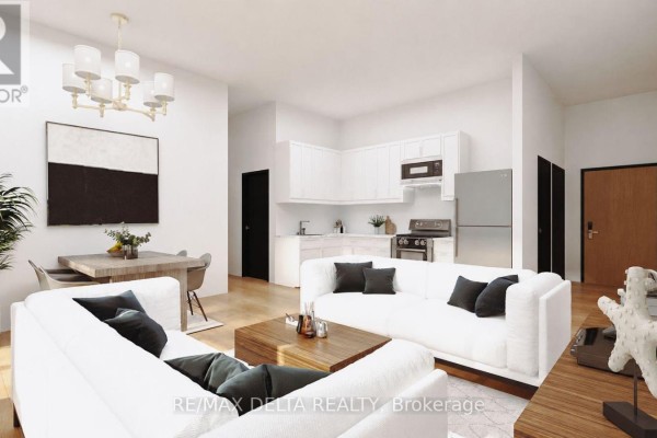 Open-concept living and dining area with white sofas and a modern chandelier. - 204-206-304-306 - 632 Laurier Street, Clarence Rockland