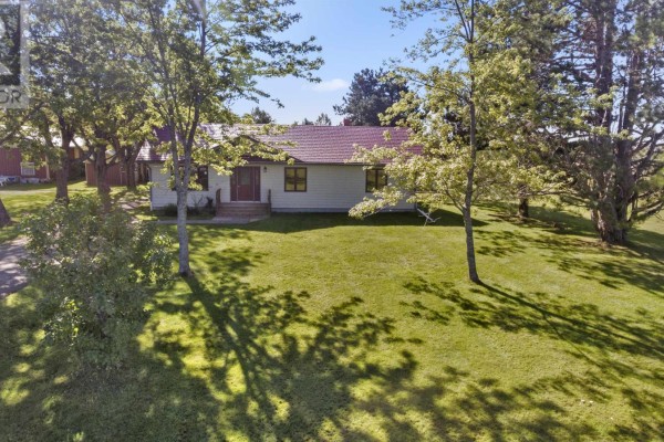 Aerial view of a rural property with several buildings and trees. - 2049 Georgetown Road, Cardigan