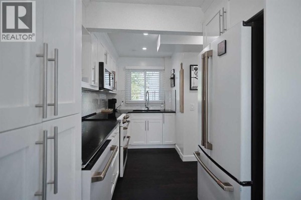Kitchen - 205, 310 Falconridge Crescent Ne, Calgary, AB T3J1H4 Photo 5