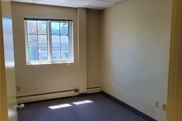 Interior view of an office with multiple doorways leading to separate rooms. - 205 - 35 The Links Road, Toronto
