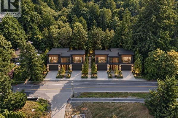 Exterior of a ranch-style house with a covered patio and fencing. - 205 Atkins Rd, View Royal