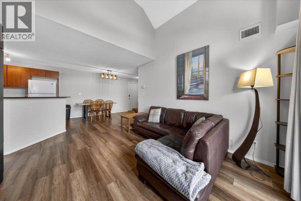 Floor plan of a two-bedroom apartment with balcony, kitchen, living, dining, and utility areas. - 205 Third Avenue Unit# 3413, Invermere
