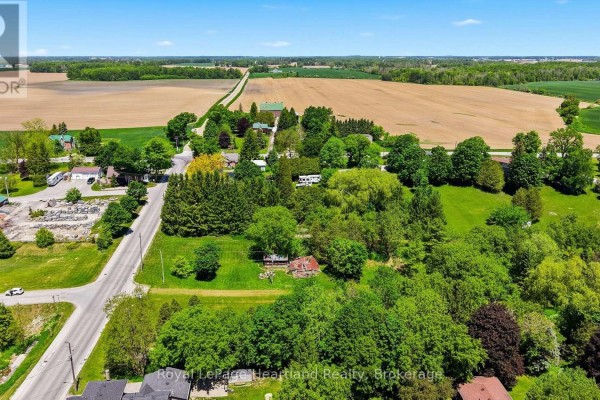Aerial view of Howick village showing houses, trees, and distant cultivated fields. - 2057 William Street, Howick