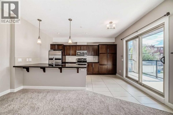 Living room - 206, 488 7 Avenue Ne, Calgary, AB T2E0N2 Photo 3