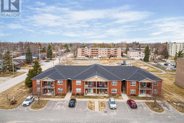 Aerial view of brick apartment complex with playground in the background. - 206 - 435 Walnut Street, Collingwood