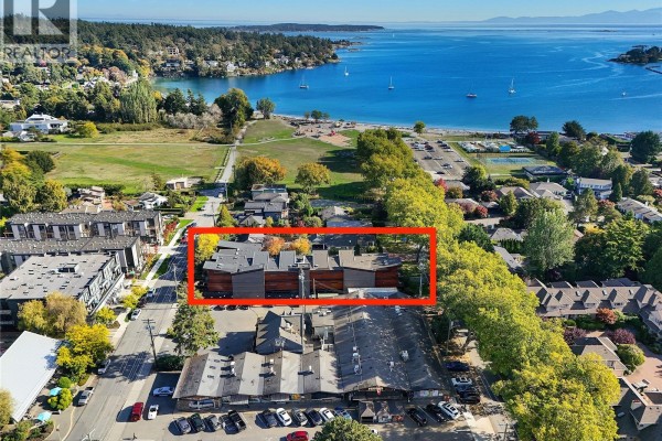 Aerial view of Saanich neighborhood with apartment building highlighted, showing proximity to water and park. - 206 2589 Penrhyn St, Saanich