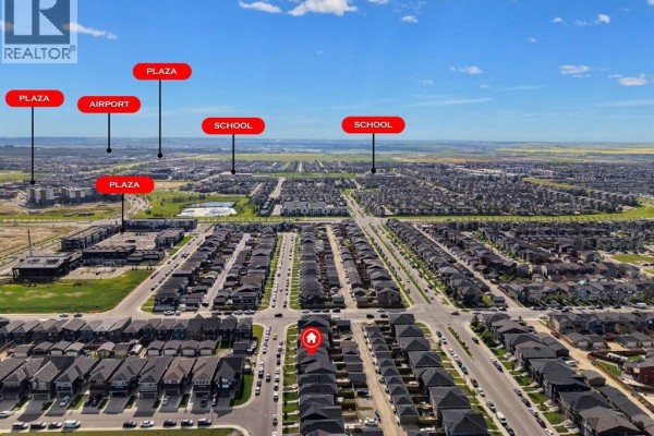 Aerial view of a residential neighborhood with labels for schools, plazas, and the airport. - 206 Cornerstone Road Ne, Calgary