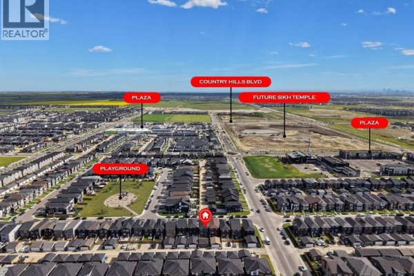 Aerial view of a residential neighborhood with labels for a playground, plazas, and country hills boulevard. - 206 Cornerstone Road Ne, Calgary