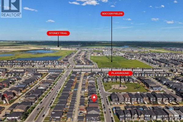 Aerial view of a residential neighborhood with labels for soccer fields, a playground, and Stoney Trail. - 206 Cornerstone Road Ne, Calgary