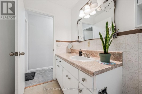 Bathroom vanity with sink and mirror - 2063 George Street Howick