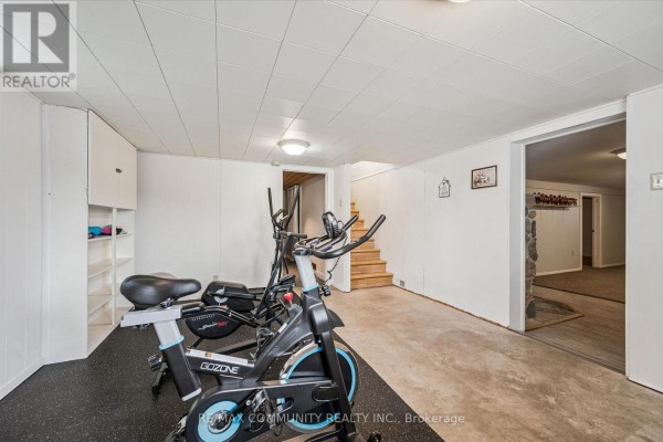 Home gym with exercise bike and elliptical - 2063 George Street Howick