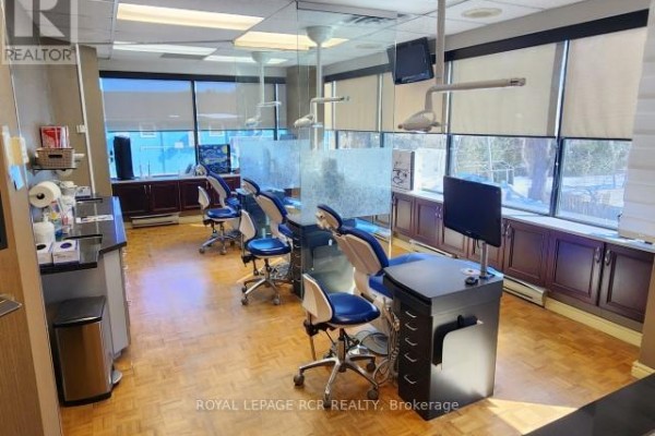 Interior view of dental office with workstations and large windows - 207 - 712 Davis Drive, Newmarket