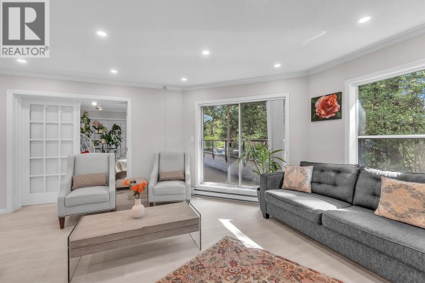 Panoramic view of Burrard Inlet and mountains from a high vantage point. - 207 1500 Ostler Court, North Vancouver