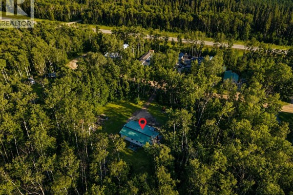 Aerial view of the property surrounded by trees and snow - 207 Brown Street, Paddockwood Rm No  520