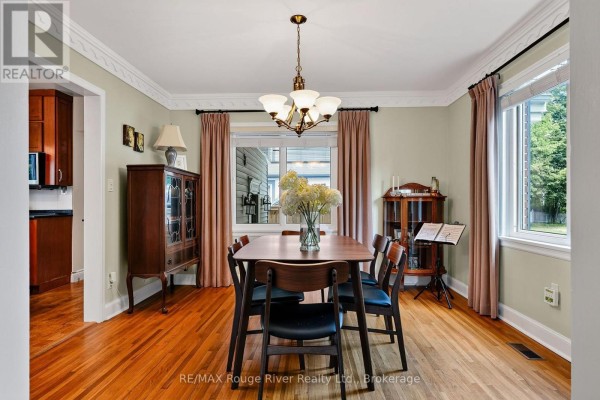 Dining room with table, chairs, china cabinet, and hardwood floors - 208 Albert Street Cobourg