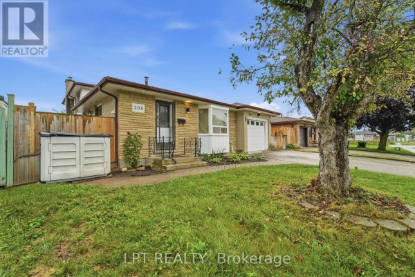 Concrete walkway along the side of the house with large windows. - 208 Deveron Crescent, London South