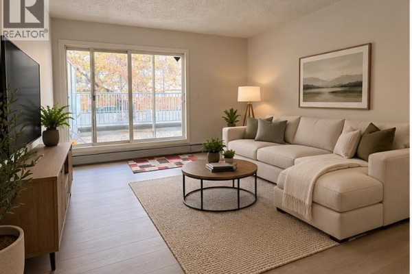 Living room - 209, 732 57 Avenue Sw, Calgary, AB T2V0H4 Photo 3