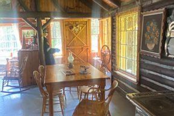 Loft space with wood paneling, a pool table, bar, dartboard, and seating area. - 209 11 Highway, Fauquier Strickland