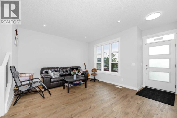 Living room - 20913 Main Street Se, Calgary, AB T3M3M1 Photo 4