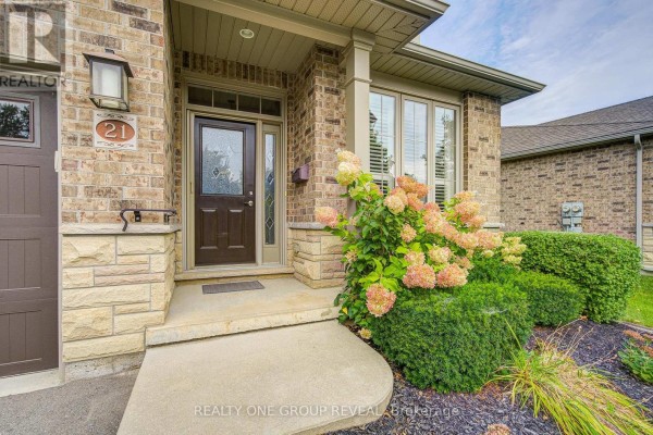 Close-up of the front entrance to a townhouse with a dark brown door and stone accents. - 21 - 30 Cedar Street, Brant