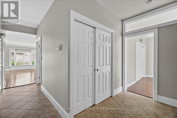 Side view of townhouse row with snow-covered driveways and landscaped yards. - 21 - 5969 Townsend Line, Lambton Shores