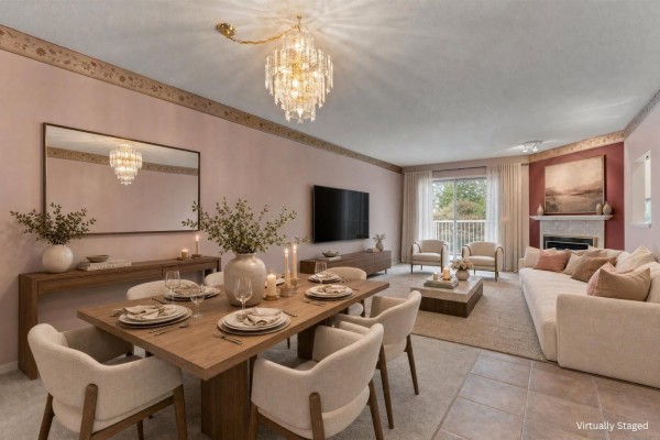 Dining and living room with a wood table, beige sofa, and fireplace. - 21 3902 Latimer Street, Abbotsford