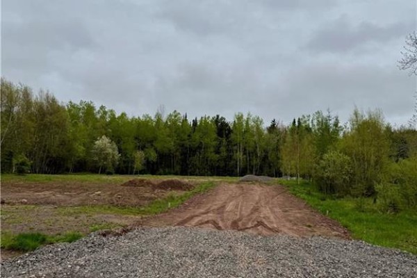 View of the cleared area with gravel path leading into wooded surroundings. - 21 Wichita Drive, Lutes Mountain