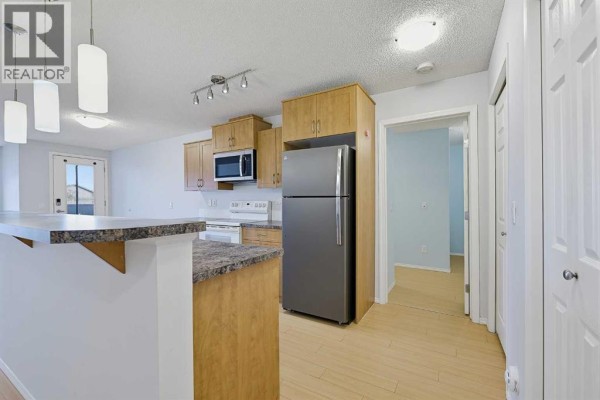 Dining room - 2105, 700 Willowbrook Road Nw, Airdrie, AB T2R0E5 Photo 3
