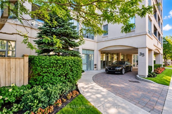 Covered entrance driveway with a paved circular path leading to the building entrance. - 211 - 35 Merton Street, Toronto