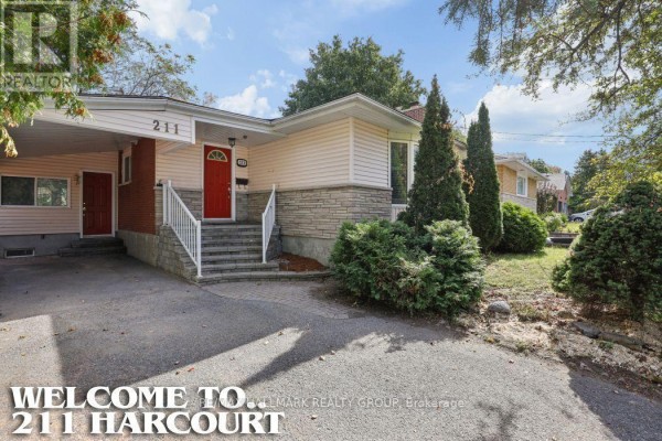 Close-up front view of the house entrance with red door and white railings. - 211 Harcourt Avenue, Ottawa