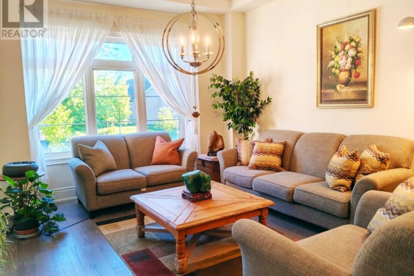 Living room with two sofas, a wooden coffee table, and a large bay window with a view. - 211 Hillsview Drive, Richmond Hill