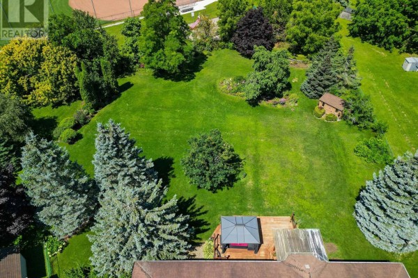 Aerial view of a large backyard with a wooden deck and gazebo. - 2114 Chantler Street, Innisfil