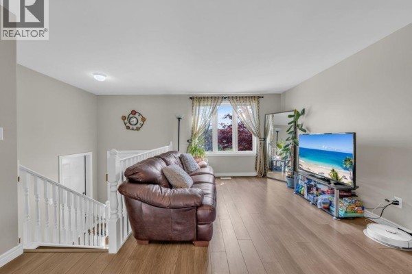 Dining area with a wooden table and chairs, and view of the kitchen. - 2115 Everts, Windsor