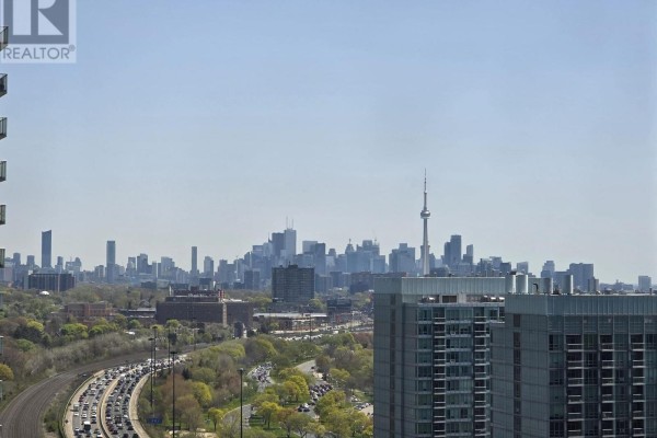 Panoramic view of Toronto skyline and highway traffic from a high-rise apartment. - 2116 - 103 The Queensway Avenue, Toronto