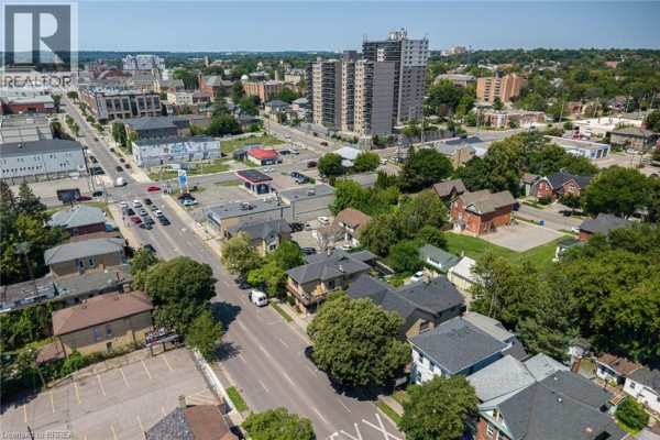 Wide aerial view of Brantford cityscape showing commercial buildings and high-rise towers. - 212-218 Dalhousie Street, Brantford