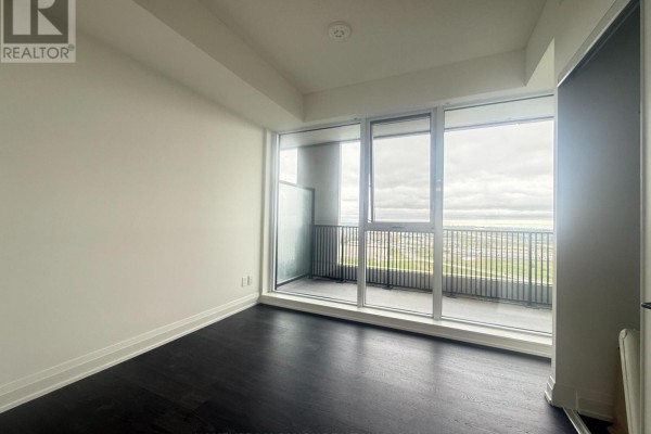 Open kitchen layout with dark cabinets and balcony access - 2120 - 56 Andre De Grasse Street, Markham