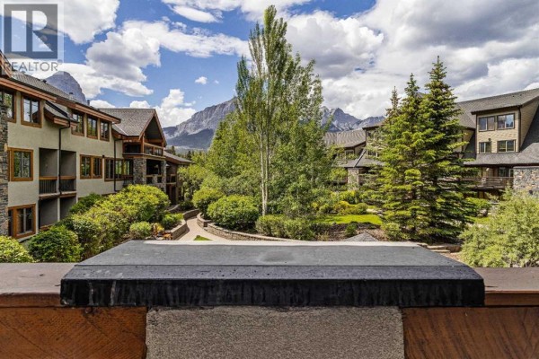 View from the balcony of mountains and trees. - 213, 505 Spring Creek Drive, Canmore
