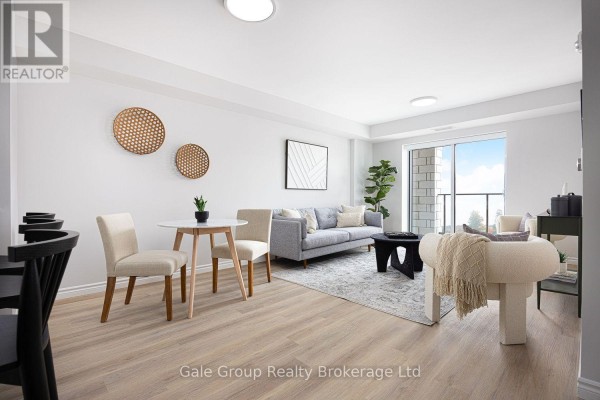 Living room with light wood floors, grey sofa, round dining table, and balcony access. - 215 - 425 Watson Parkway N, Guelph