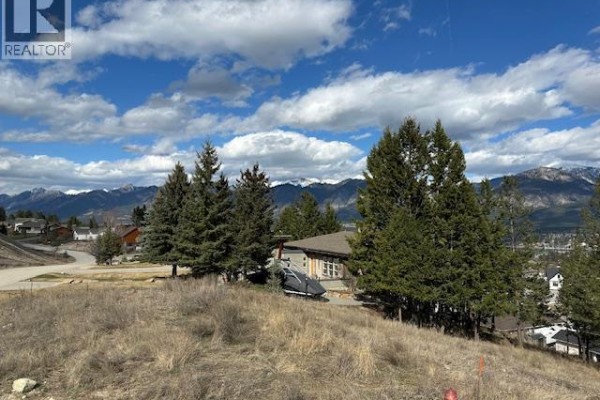 View of a partially built house and surrounding landscape with mountains. - 2151 Pineridge Drive Lot# 27, Invermere