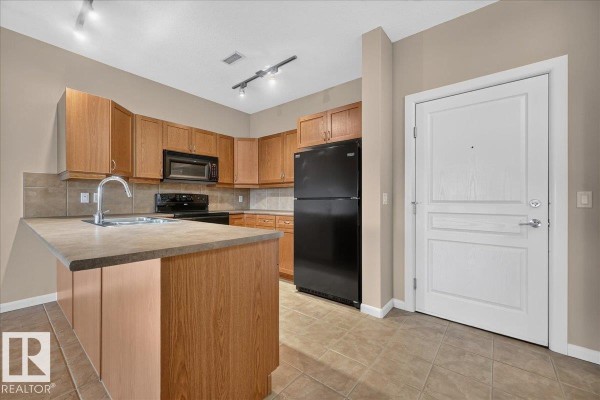 Laundry room - #217 160 Magrath Rd Nw, Edmonton, AB T6R3T7 Photo 5